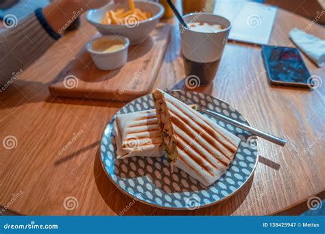 Mexican Fast Food Wrapped Burritos with Chicken and Vegetables Closeup at Plate on Table Stock ...