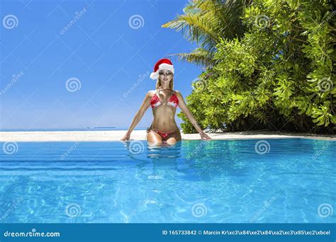 Christmas Travel Beach Holidays in Maldives. Christmas Maldives Beach and Santa Claus Woman ...