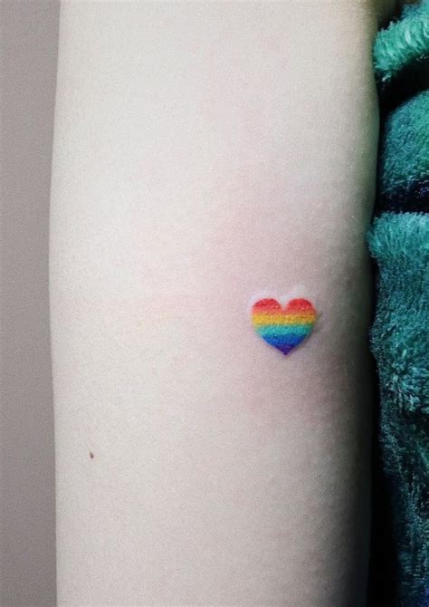 Tiny Heart Tattoo | Rainbow tattoos, Subtle tattoos, Tiny heart tattoos