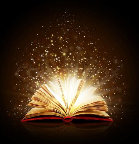 Open magic book with magic lights on a ... | Stock image | Colourbox