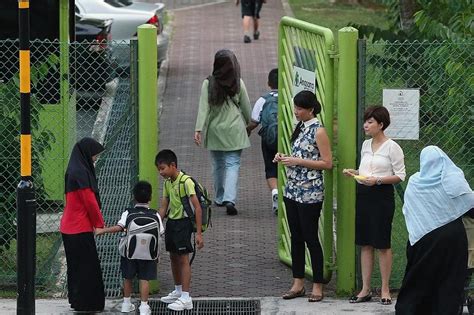 1st day for some schoolchildren, holiday for others | The Straits Times