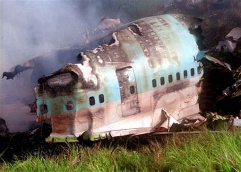 Korean Airlines flight 801 wreckage burns at the Sasa Valley crash site.