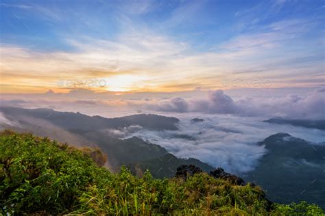 Sunrise on Phu Chi Fa Forest Park, Thailand Stock Photo by yongkiet