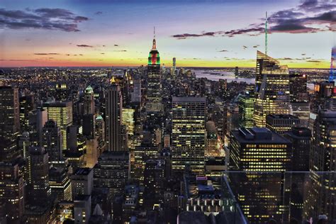 view of the new york city skyline from top of the rock at sunset, the city at sunset 4k HD Wallpaper