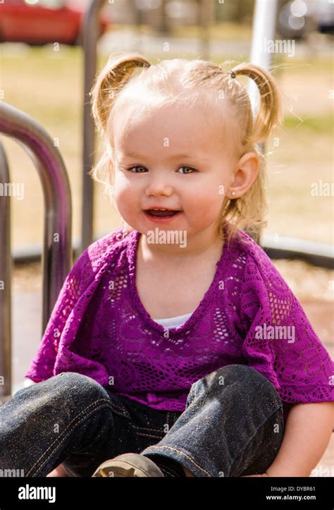 Cute, adorable 16 month little girl playing on a park playground Stock Photo - Alamy