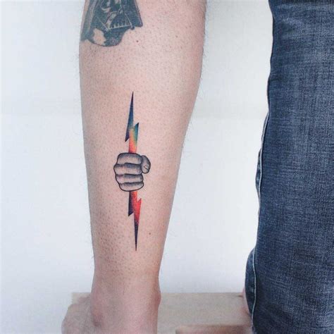 Hand with a lightning bolt tattoo on the left calf | Bolt tattoo, Hand ...