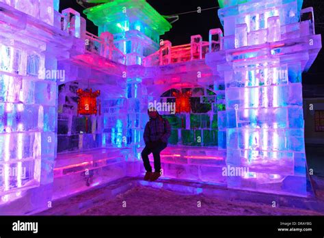 The 30th Harbin International Ice and Snow Sculpture Festival in 2014. China. Male person taking ...