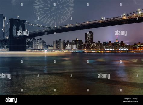 amazing sparkling fireworks Brooklyn Bridge at dusk viewed from the Brooklyn Bridge Park in New ...