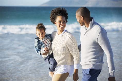 Happy family having fun on beach — backdrop, coast - Stock Photo | #202449706