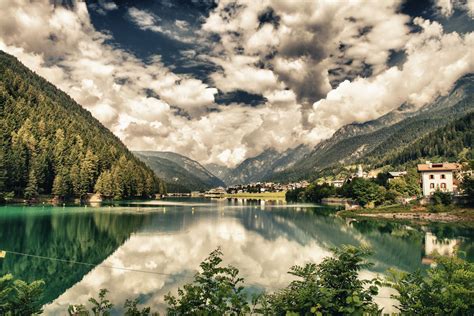 A reflective lake in the Italian Alps. | Travel, Places to visit ...