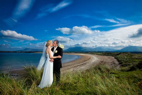 wedding photographers in sligo couple kiss at mullaghmore beach | Donegal and Sligo Wedding ...