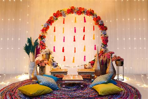 Our colourful contrasting décor setup of Vibrant mehndi decoration will surely be a blast for ...