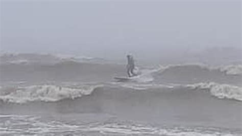 Surfers enjoy the waves on Lake Michigan