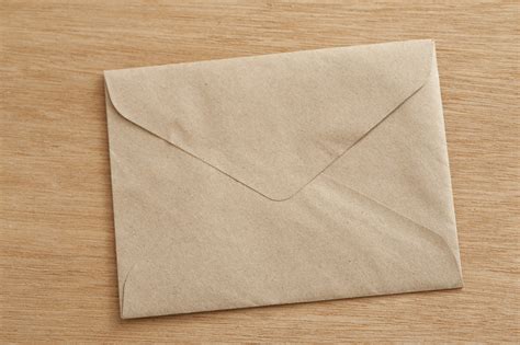 Free Stock Photo 10574 Closed Brown Envelope on Wooden Table ...