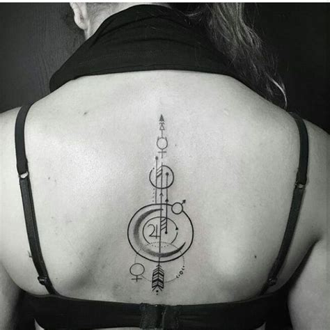 a woman with a tattoo on her back