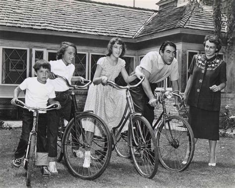 Anthony Quinn and kids ride bikes