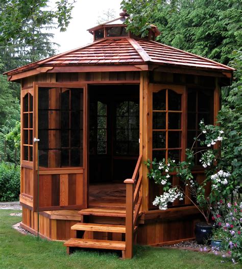 The rich hardwood tones of this wooden gazebo make it a beautiful addition to any yard. Relaxing ...