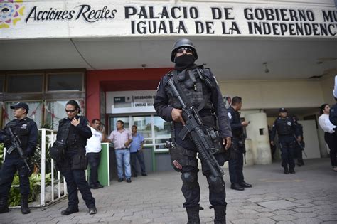 Mexico disarms police in missing students' city