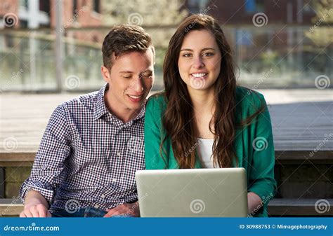 Close Up Portrait of Two College Students Working on Laptop Outdoors Stock Image - Image of ...
