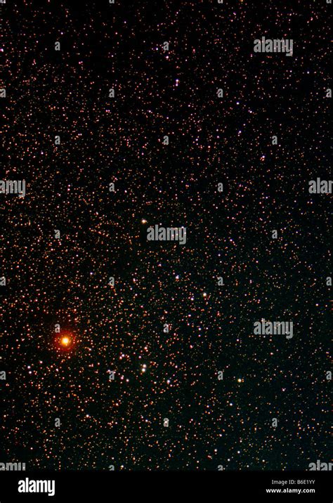 The red giant star Aldebaran dominates the picture of stars in the ...