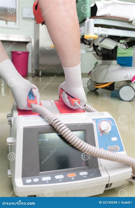 Before Defibrillation. Doctor With Electric Defibrillator Royalty Free Stock Photos - Image ...