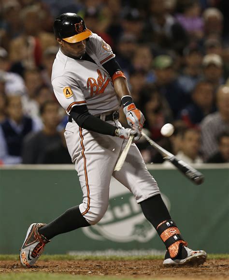 Adam Jones #10 of the Baltimore Orioles breaks his bat on an infield ...