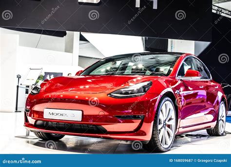 Metallic Red Tesla Model 3 at Brussels Motor Show, Produced by American Automaker Tesla, Main ...