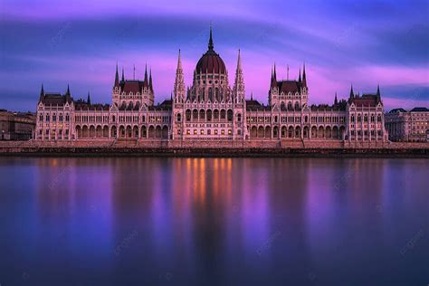 Budapests Hungarian Parliament Building Against A Sunset Backdrop With The Danube River Photo ...