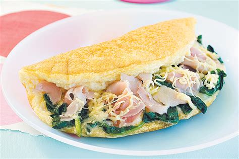 Fluffy omelette with ham, spinach and Swiss cheese