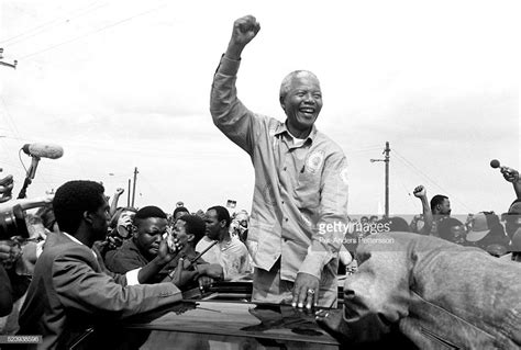 Nelson Mandela in 1994 Nelson Mandela acknowledges a crowd of ANC ...