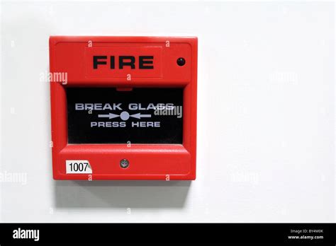 Red fire alarm box break glass Stock Photo - Alamy