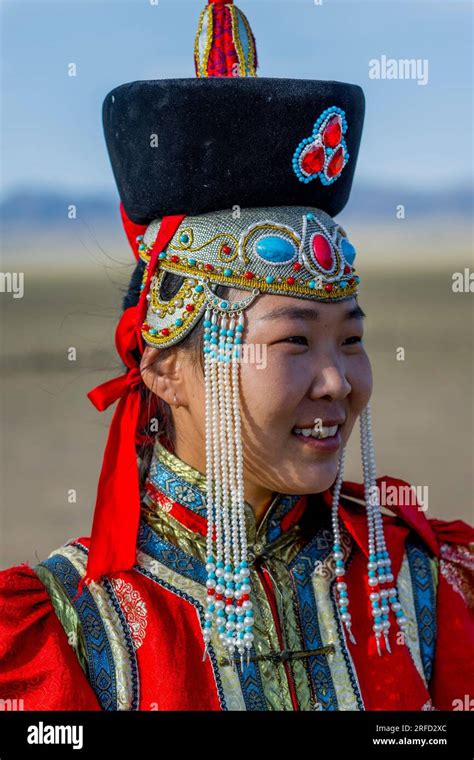 A Mongolian young woman in traditional dress at the Gobi Mirage lodge in the Gobi Desert ...