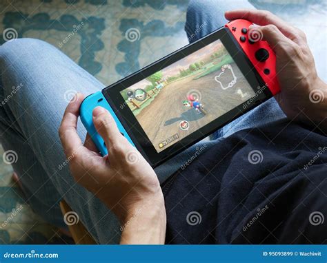 A Man Playing Mario Kart 8 Deluxe on Nintendo Switch. Editorial Stock Image - Image of ...