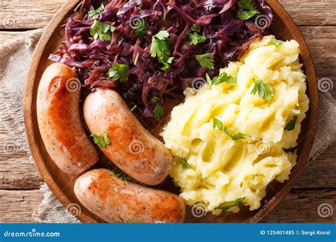 German Cuisine: Mashed Potatoes, Stewed Red Cabbage and Sausages Stock ...