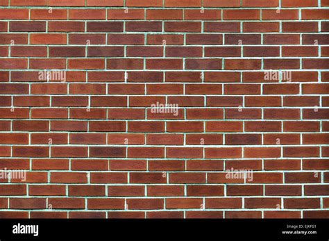 Clay brick wall background and texture Stock Photo - Alamy