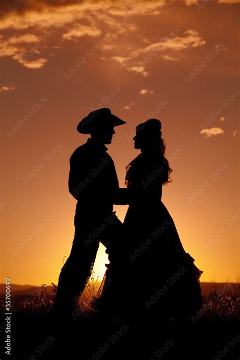 Cowboy couple silhouette in love Stock Photo | Adobe Stock