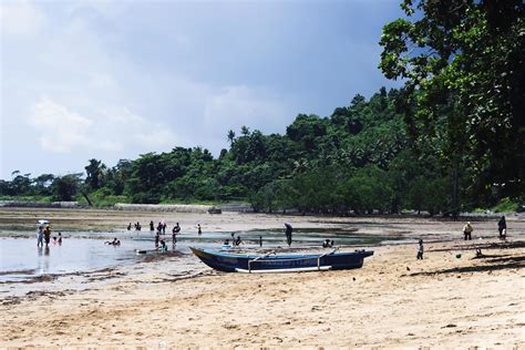 Sorong, Indonesia 2021- People on the beach 3363922 Stock Photo at Vecteezy