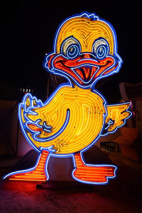 Ugly Duckling neon sign lights up Neon Museum’s Boneyard | Las Vegas ...