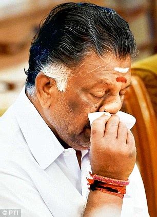 A reluctant leader: Tearful O. Panneerselvam sworn in as Tamil Nadu Chief Minister after Jaya's ...