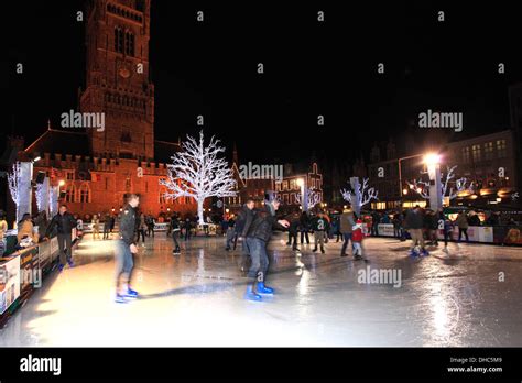 Panned camera effect on People skating on the Christmas Ice rink ...