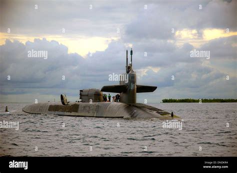 US Navy sailors aboard the guided-missile submarine USS Georgia prepare ...