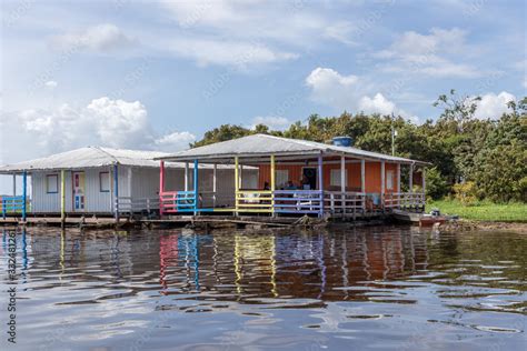 floating house in the amazon river Stock Photo | Adobe Stock