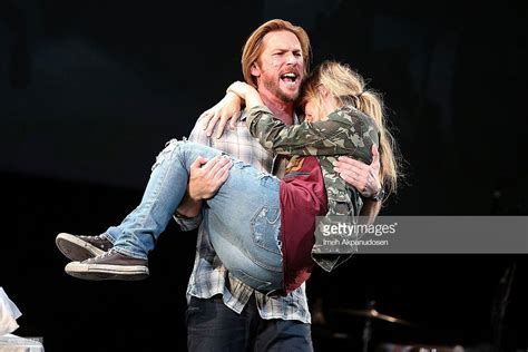 Actor troy baker and actress ashley johnson perform onstage during ...