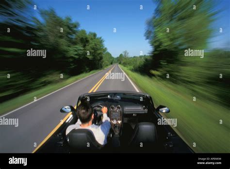 Man driving sports car Stock Photo - Alamy