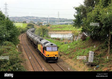 A freight train consisting of oil tankers crosses Rishton reservoir in ...