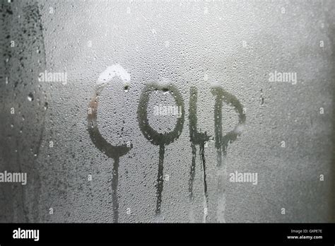 Cold text written in condensation on glass window pane Stock Photo - Alamy