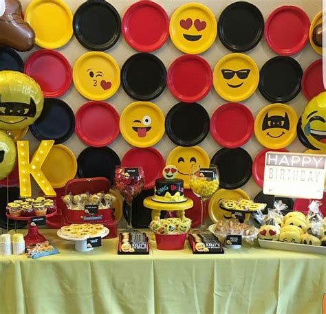 a table topped with plates and desserts covered in emoticions on top of ...