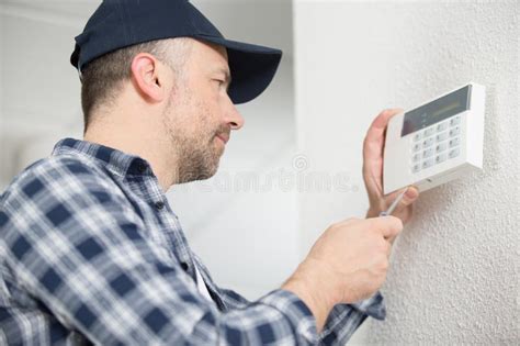 Installing Programmable Room Thermostat Stock Image - Image of hands ...