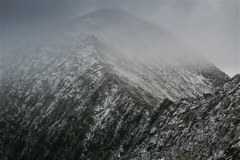 Gray and Black Mountain in Fog · Free Stock Photo