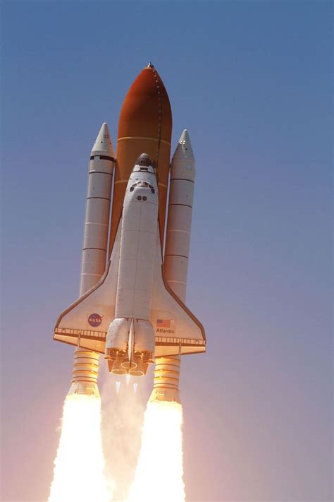 a space shuttle taking off into the sky